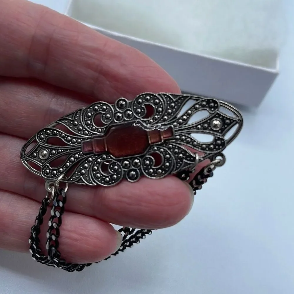 Vintage Victorian looking enamel dropping chains brooch.